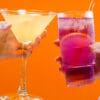 Two people drinking cocktails