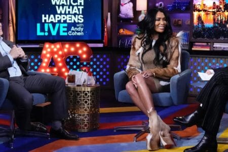 Brit Eady Appeared on WWHL in a Brown Vintage Roberto Cavalli Dress with a Dior Handbag and Christian Louboutin Boots