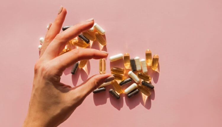 woman picking supplements for women