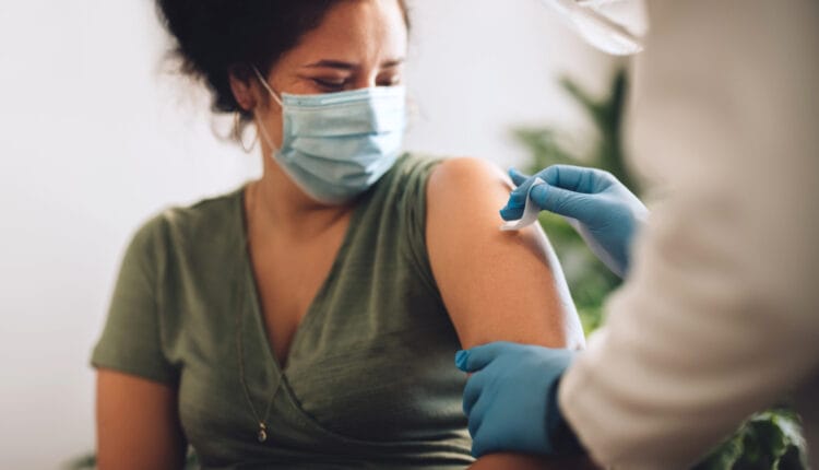 woman in flu season getting flu vaccine