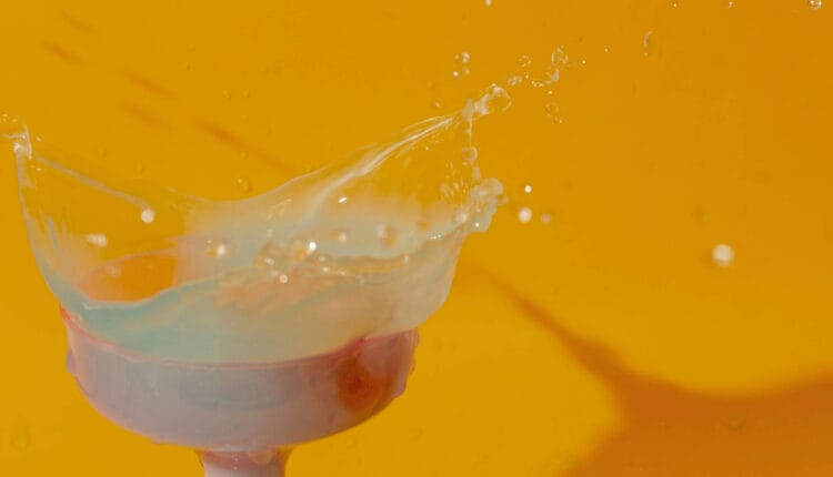 liquid spilling from a cocktail glass