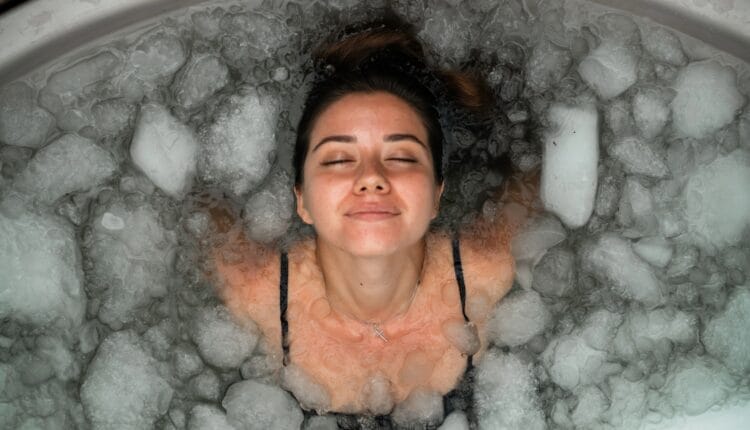 Woman in ice bath smiling