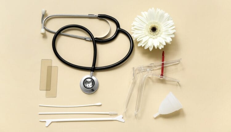 Pap smear equipment on beige backdrop
