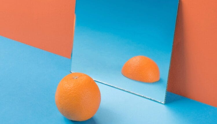 Orange facing mirror and seeing it is only half-cut, not good enough